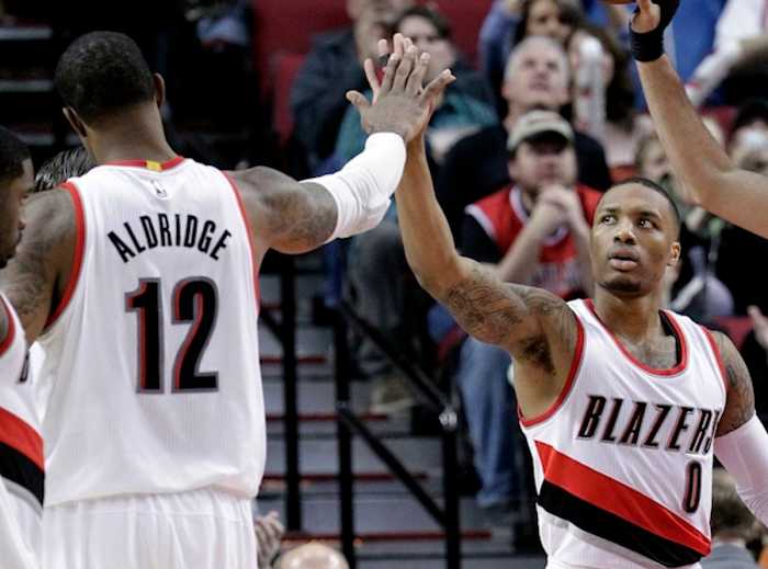 With LaMarcus Aldridge (l) off to San Antonio, can Damian Lillard be the face of the Blazers?